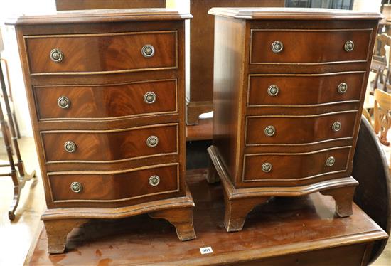 A pair of miniature chest of drawers H.61cm